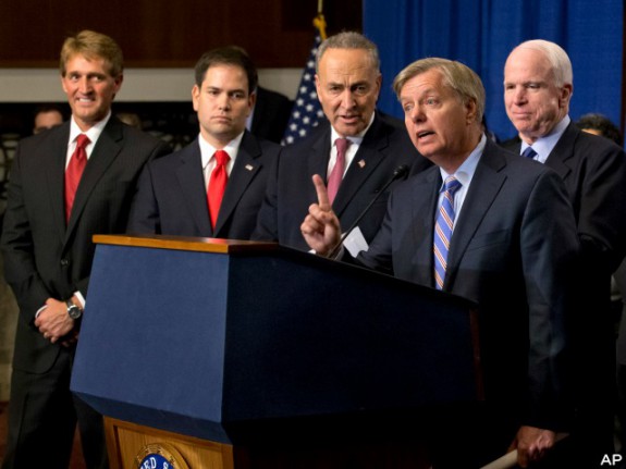 While Graham (R-SC) plays his instrument of choice (the "lyre") at the mic while Schumer (D-NY) giggles at the joys of his (the fool) while McCain (R-AZ) ponders where to deposit his loot from the MIC, Rubio (R-FL) looks like he'd rather be anywhere, and...I dunno who that weirdo to the far left is off of the top of my head. Oh well. Mustn't matter.